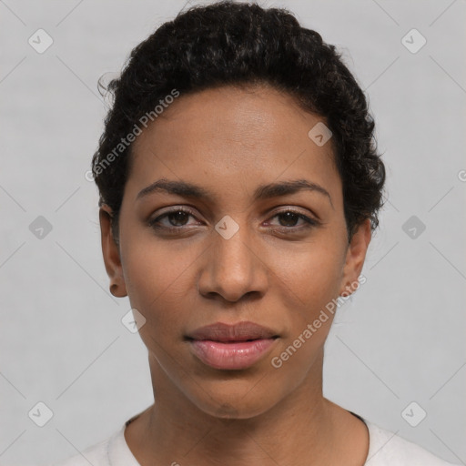 Joyful latino young-adult female with short  black hair and brown eyes