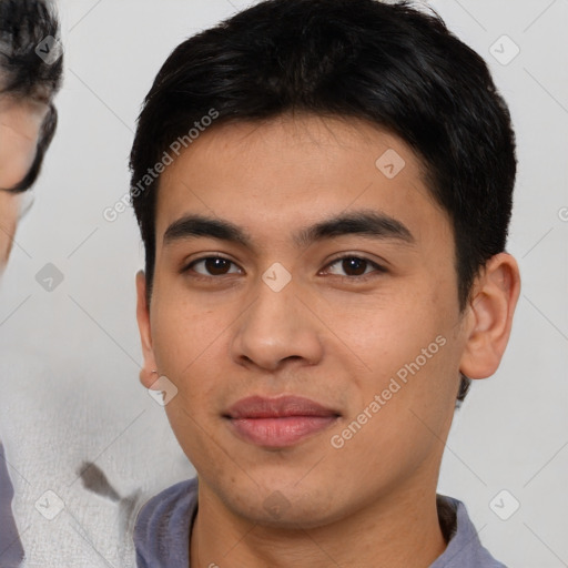 Joyful asian young-adult male with short  brown hair and brown eyes