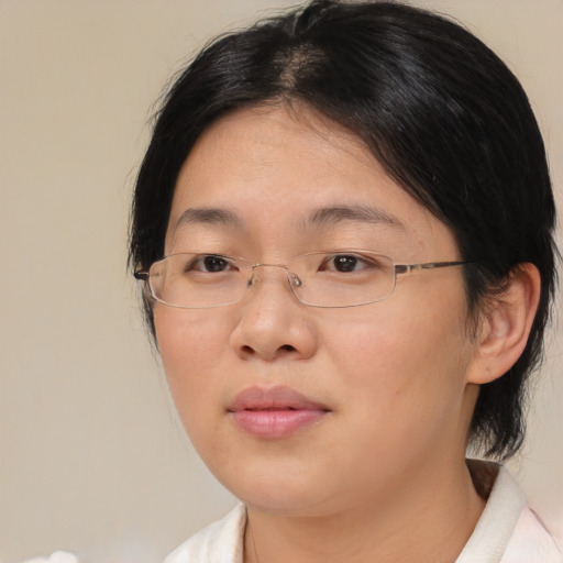 Neutral asian young-adult female with medium  brown hair and brown eyes