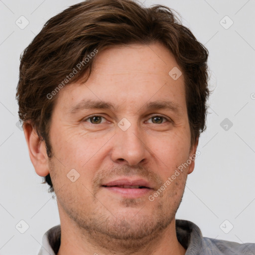 Joyful white adult male with short  brown hair and grey eyes