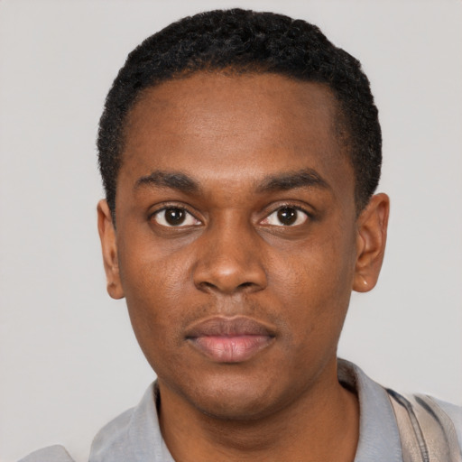 Neutral black young-adult male with short  black hair and brown eyes