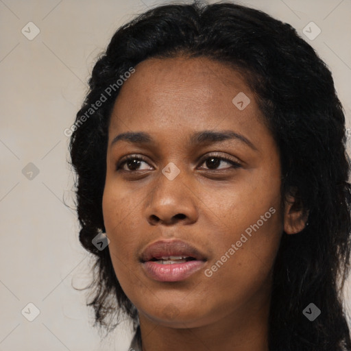 Joyful black young-adult female with long  black hair and brown eyes