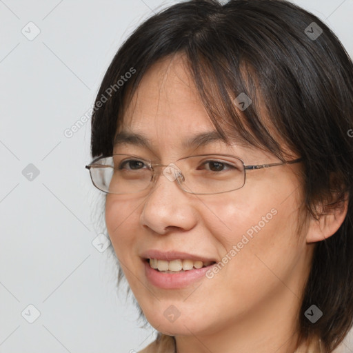 Joyful white adult female with medium  brown hair and brown eyes