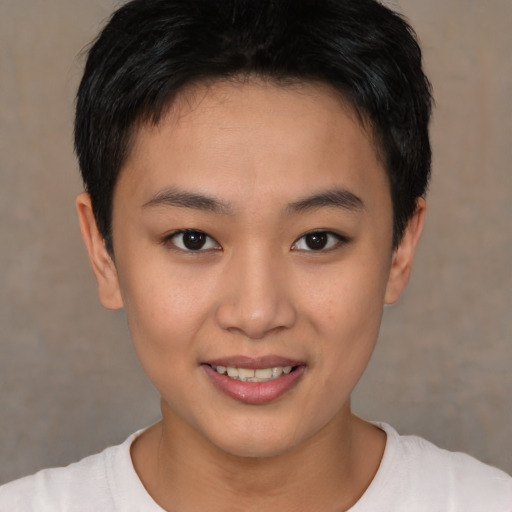 Joyful asian young-adult female with short  brown hair and brown eyes