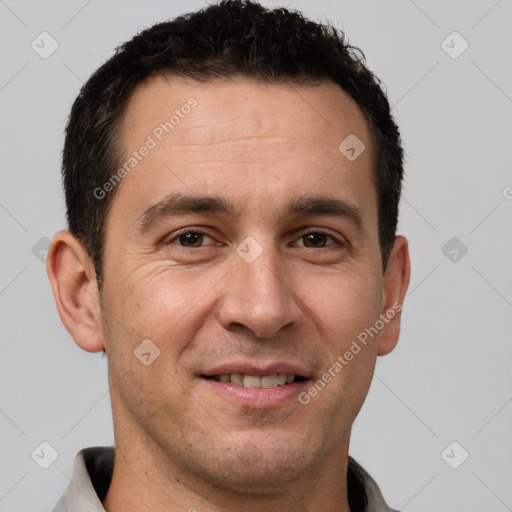 Joyful white adult male with short  brown hair and brown eyes