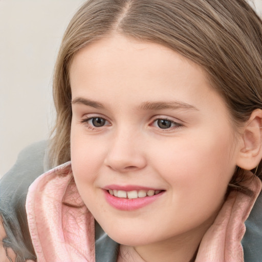 Joyful white child female with long  brown hair and brown eyes