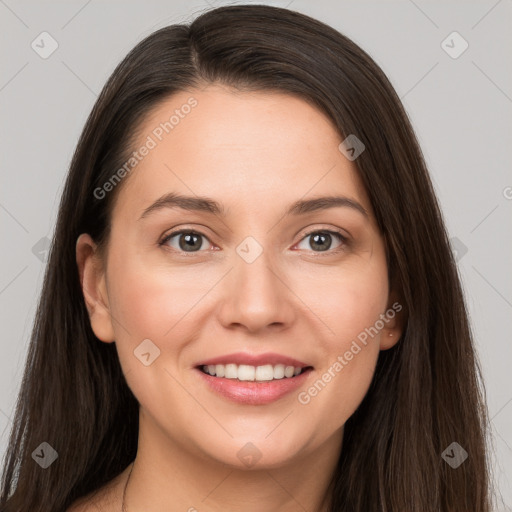 Joyful white young-adult female with long  brown hair and brown eyes