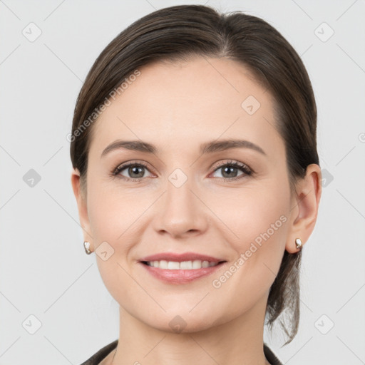 Joyful white young-adult female with medium  brown hair and grey eyes