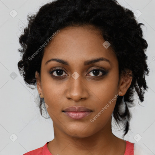 Joyful black young-adult female with medium  black hair and brown eyes