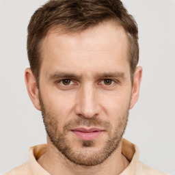 Joyful white adult male with short  brown hair and brown eyes