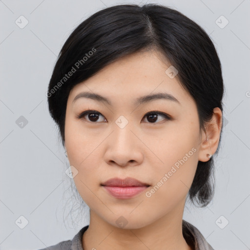 Joyful asian young-adult female with medium  black hair and brown eyes