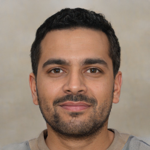 Neutral latino young-adult male with short  black hair and brown eyes