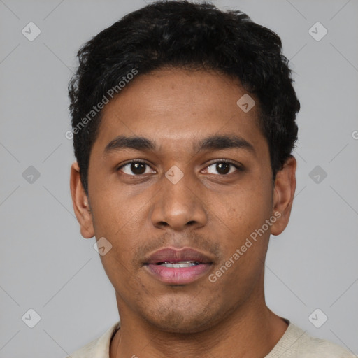 Joyful latino young-adult male with short  black hair and brown eyes