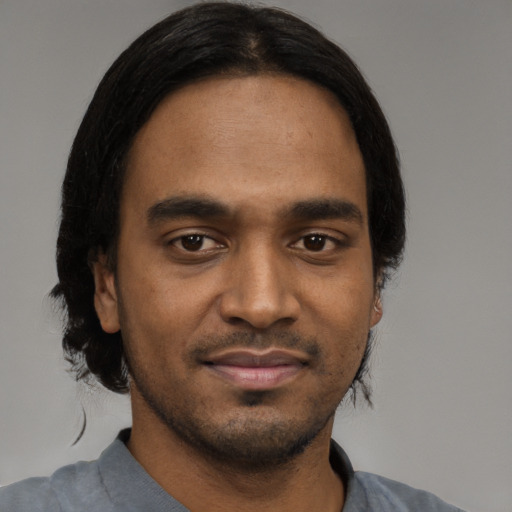 Neutral black young-adult male with short  black hair and brown eyes