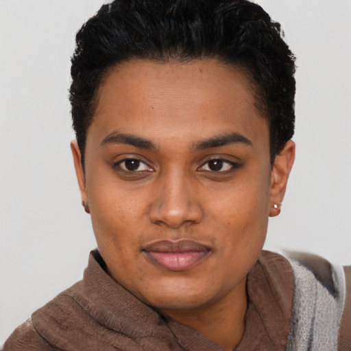 Joyful black young-adult female with short  brown hair and brown eyes