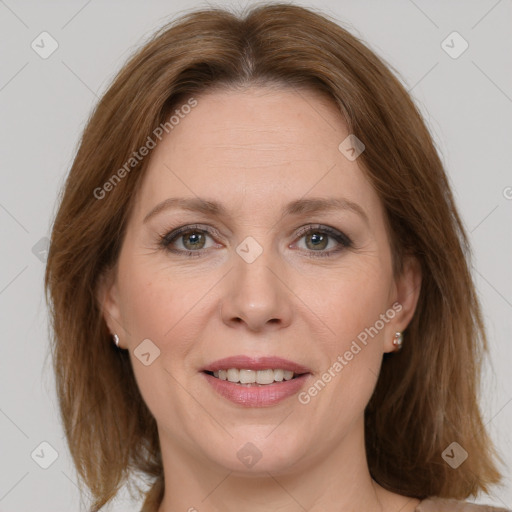 Joyful white adult female with medium  brown hair and grey eyes