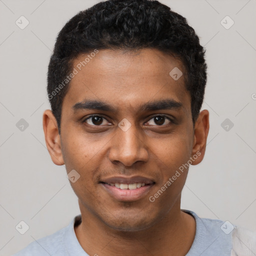 Joyful black young-adult male with short  black hair and brown eyes