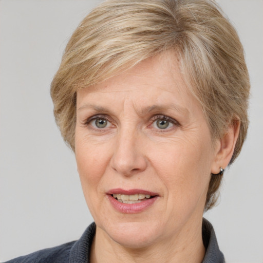 Joyful white adult female with short  brown hair and grey eyes