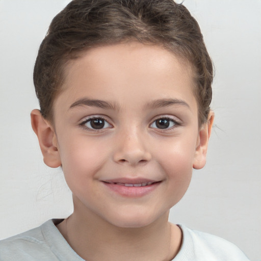 Joyful white child female with short  brown hair and brown eyes