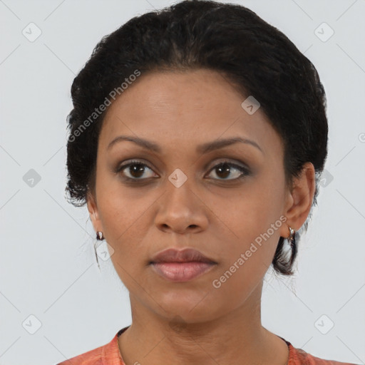 Joyful black young-adult female with short  brown hair and brown eyes