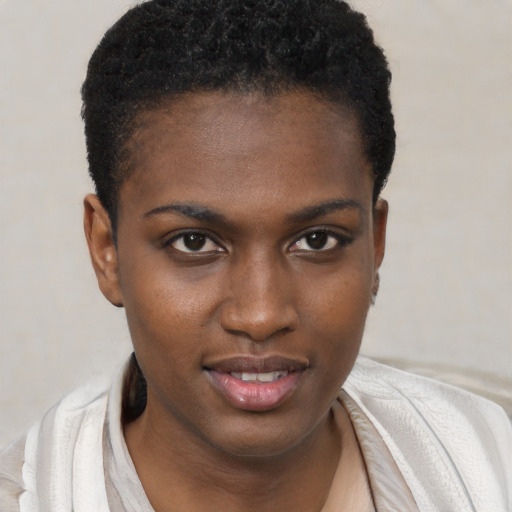 Joyful black young-adult female with short  brown hair and brown eyes