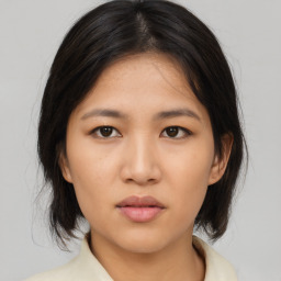 Neutral asian young-adult female with medium  brown hair and brown eyes