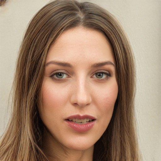 Joyful white young-adult female with long  brown hair and green eyes