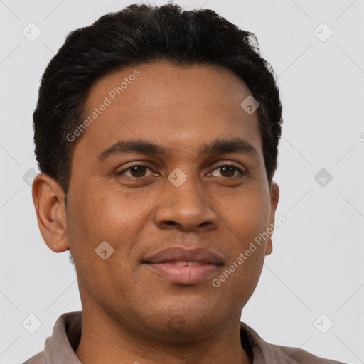 Joyful latino young-adult male with short  brown hair and brown eyes