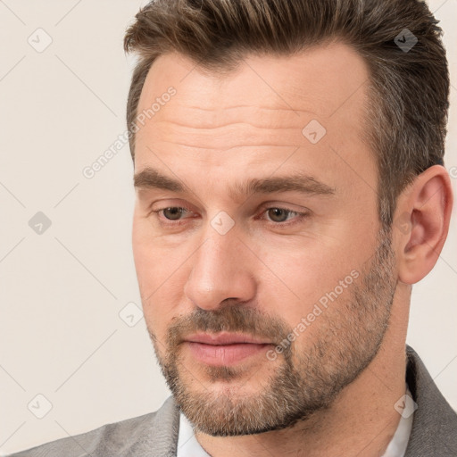 Joyful white adult male with short  brown hair and brown eyes