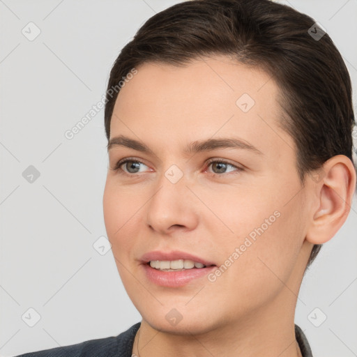 Joyful white young-adult female with short  brown hair and brown eyes