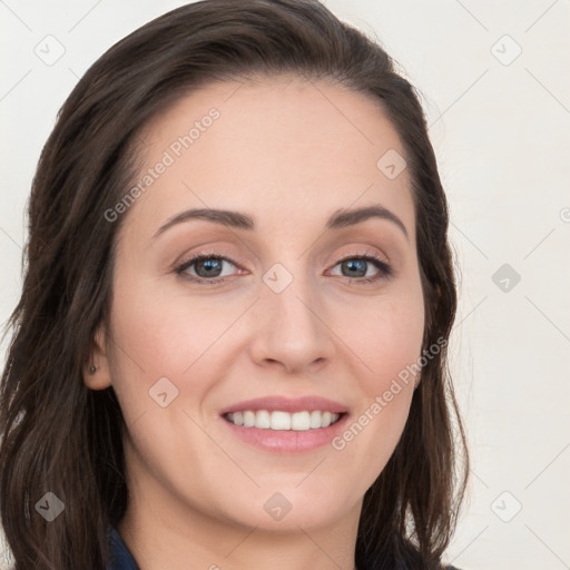 Joyful white young-adult female with long  brown hair and blue eyes