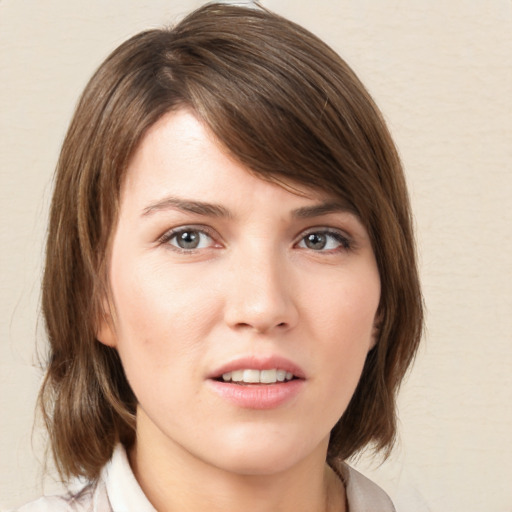 Neutral white young-adult female with medium  brown hair and green eyes