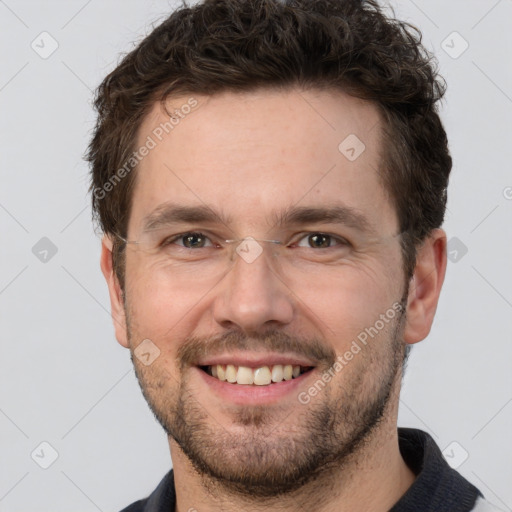 Joyful white adult male with short  brown hair and grey eyes