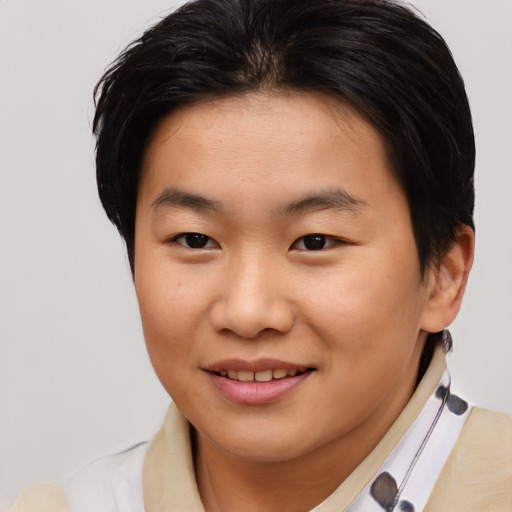 Joyful asian young-adult female with short  brown hair and brown eyes