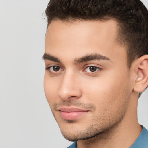 Neutral white young-adult male with short  brown hair and brown eyes