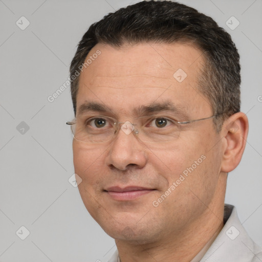 Joyful white adult male with short  brown hair and brown eyes