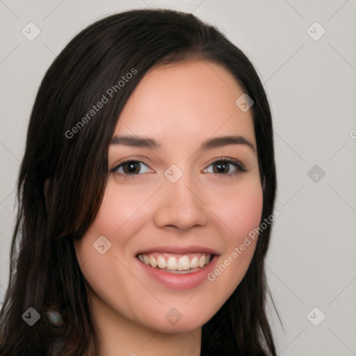 Joyful white young-adult female with long  black hair and brown eyes