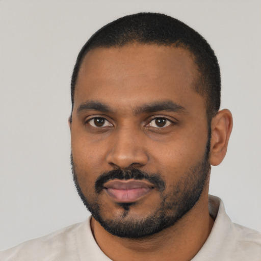 Neutral black young-adult male with short  black hair and brown eyes