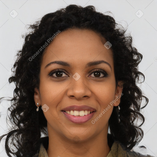 Joyful black young-adult female with long  brown hair and brown eyes