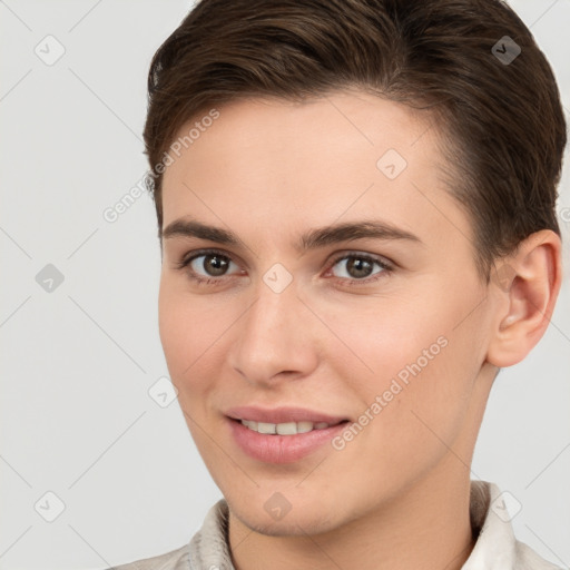 Joyful white young-adult female with short  brown hair and brown eyes