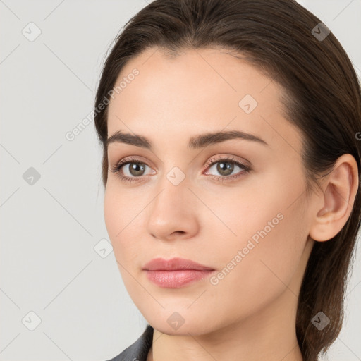 Neutral white young-adult female with long  brown hair and brown eyes