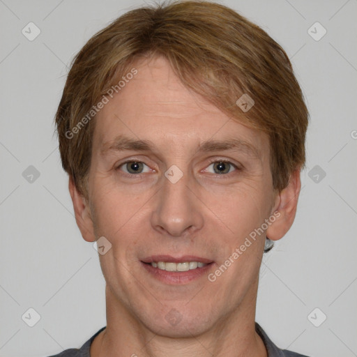 Joyful white adult male with short  brown hair and grey eyes