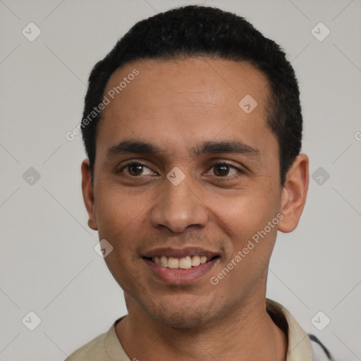 Joyful latino young-adult male with short  black hair and brown eyes