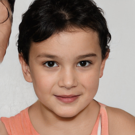 Joyful white child female with short  brown hair and brown eyes