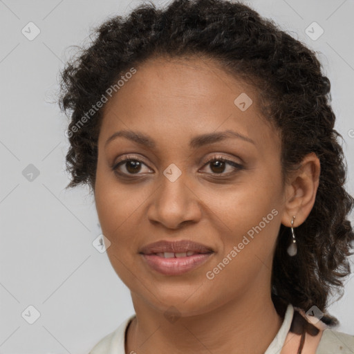 Joyful black adult female with short  brown hair and brown eyes