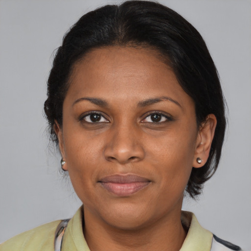 Joyful asian adult female with medium  brown hair and brown eyes