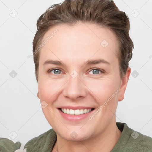 Joyful white young-adult female with short  brown hair and grey eyes