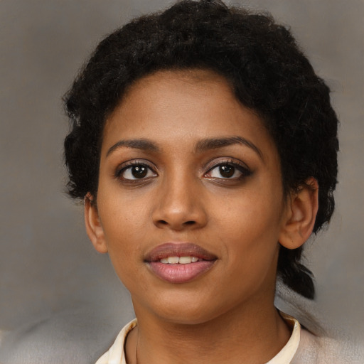 Neutral black young-adult female with short  black hair and brown eyes