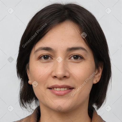 Joyful white adult female with medium  brown hair and brown eyes