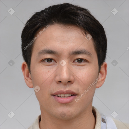 Joyful asian young-adult male with short  brown hair and brown eyes